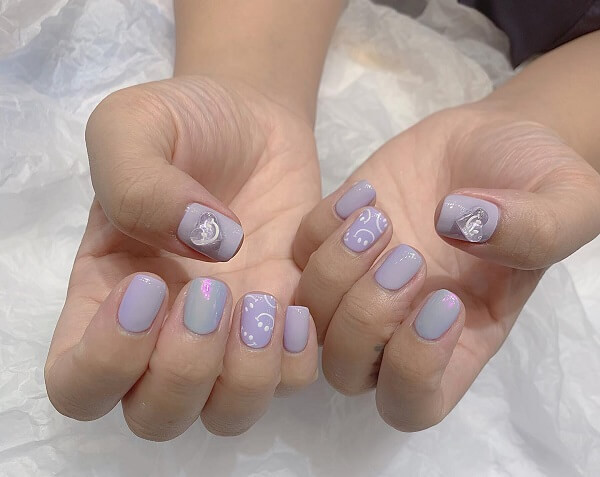 Nail màu tím đính đá cầu kỳ