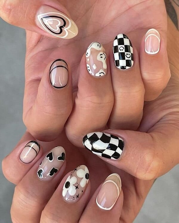 alt: Mẫu nail đen trắng cute với họa tiết nơ