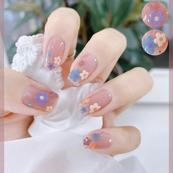 alt: Mẫu nail xinh cute với họa tiết trái tim và nơ